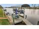 Wooden boat dock with seating area and covered boat lift at 15361 Visalia Rd, Port Charlotte, FL 33981
