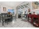 Bright dining area with glass-top table and view of lanai at 15361 Visalia Rd, Port Charlotte, FL 33981