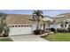 Charming single-Gathering home with an attached garage, driveway, and beautiful landscaping at 15361 Visalia Rd, Port Charlotte, FL 33981