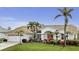 Lovely single-Gathering home with a well-manicured lawn, beautiful tropical landscaping and a welcoming entryway at 15361 Visalia Rd, Port Charlotte, FL 33981