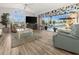 Bright living room with pool view and light wood flooring at 15361 Visalia Rd, Port Charlotte, FL 33981