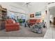 Comfortable living room with coral and blue accents and view to lanai at 15361 Visalia Rd, Port Charlotte, FL 33981