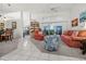 Relaxing living room with coral colored sofas and tile floors at 15361 Visalia Rd, Port Charlotte, FL 33981