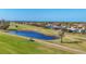 Aerial view of golf course community with homes and waterways at 162 Annapolis Ln, Rotonda West, FL 33947