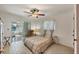 Bright bedroom with a queen bed and access to a patio at 162 Annapolis Ln, Rotonda West, FL 33947