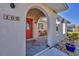 Inviting front porch with arched entryway and terracotta tile flooring at 162 Annapolis Ln, Rotonda West, FL 33947