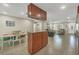 Kitchen with breakfast bar, view to living room, and tile flooring at 162 Annapolis Ln, Rotonda West, FL 33947