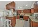 Kitchen with island, stainless steel appliances, and granite countertops at 162 Annapolis Ln, Rotonda West, FL 33947