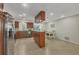Open kitchen features island, stainless steel appliances, and tile flooring at 162 Annapolis Ln, Rotonda West, FL 33947