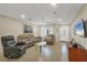 Bright living room featuring a large TV and comfy furniture at 162 Annapolis Ln, Rotonda West, FL 33947