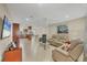 Spacious living room with light tile floors and comfortable seating at 162 Annapolis Ln, Rotonda West, FL 33947