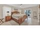 Main bedroom with wood furniture and access to patio at 162 Annapolis Ln, Rotonda West, FL 33947