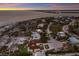 Aerial view of beachfront home and neighborhood at 16271 N Island Ct, Boca Grande, FL 33921