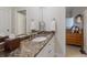 Bathroom with granite countertop and a sink at 16271 N Island Ct, Boca Grande, FL 33921