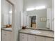 Bathroom with double vanity and mosaic tile at 16271 N Island Ct, Boca Grande, FL 33921