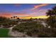 Scenic beach access walkway with vibrant sunset colors at 16271 N Island Ct, Boca Grande, FL 33921
