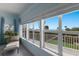 Bedroom with ocean view and sitting area at 16271 N Island Ct, Boca Grande, FL 33921