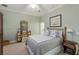 Bedroom with bamboo bed frame and beach decor at 16271 N Island Ct, Boca Grande, FL 33921