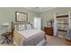Bedroom with bamboo bed frame and beach decor at 16271 N Island Ct, Boca Grande, FL 33921