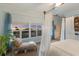 Serene bedroom with sunset views and a cozy sitting area at 16271 N Island Ct, Boca Grande, FL 33921