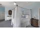 Bedroom with canopy bed and light blue walls at 16271 N Island Ct, Boca Grande, FL 33921