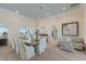 Bright dining room with ocean views and seating for six at 16271 N Island Ct, Boca Grande, FL 33921