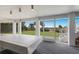 Game room with pool table, beach views, and access to backyard at 16271 N Island Ct, Boca Grande, FL 33921