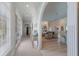 Elegant hallway leading to living areas with hardwood floors at 16271 N Island Ct, Boca Grande, FL 33921