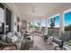 Screened lanai with outdoor furniture and ocean view at 16271 N Island Ct, Boca Grande, FL 33921