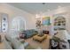 Comfortable living room with fireplace and built-in shelving at 16271 N Island Ct, Boca Grande, FL 33921