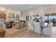 Spacious living and dining area with ocean views and hardwood floors at 16271 N Island Ct, Boca Grande, FL 33921