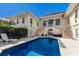 Inviting swimming pool with patio furniture and lush greenery at 16271 N Island Ct, Boca Grande, FL 33921