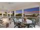 Relaxing outdoor porch with ocean views and seating area at 16271 N Island Ct, Boca Grande, FL 33921