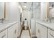 Modern bathroom with double vanity and a walk-in shower at 1751 Beach Rd # 403, Englewood, FL 34223