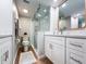 Updated bathroom with double vanity, walk-in shower, and modern finishes at 1751 Beach Rd # 403, Englewood, FL 34223