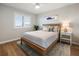 Cozy bedroom with light wood furniture and a tranquil atmosphere at 1751 Beach Rd # 403, Englewood, FL 34223