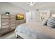 Spacious bedroom with dresser and a comfortable bed at 1751 Beach Rd # 403, Englewood, FL 34223