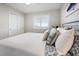 Bright bedroom with a comfortable bed and plenty of closet space at 1751 Beach Rd # 403, Englewood, FL 34223