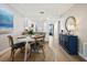 View of a dining area with a round table and four chairs, adjacent to kitchen at 1751 Beach Rd # 403, Englewood, FL 34223