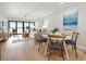 Bright dining area with a round table and four chairs, kitchen and living room views at 1751 Beach Rd # 403, Englewood, FL 34223