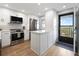 Modern kitchen with white cabinets, stainless steel appliances, and quartz countertops at 1751 Beach Rd # 403, Englewood, FL 34223