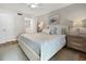 Spacious main bedroom with king-size bed and ensuite bathroom access at 1751 Beach Rd # 403, Englewood, FL 34223