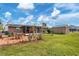 Backyard oasis with patio, solar panels and storage shed at 1780 Morning Dove Ln, Englewood, FL 34224
