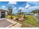 Spacious backyard patio, fire pit, and fenced yard at 1780 Morning Dove Ln, Englewood, FL 34224