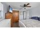 Bedroom with double bed, white dresser and wood armoire at 1780 Morning Dove Ln, Englewood, FL 34224