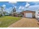 Charming ranch home with a large grassy yard at 1780 Morning Dove Ln, Englewood, FL 34224