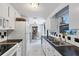 Bright kitchen with white cabinets and a dining area at 1780 Morning Dove Ln, Englewood, FL 34224