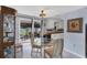 Kitchen features white cabinets, black countertops, and view to backyard at 1780 Morning Dove Ln, Englewood, FL 34224