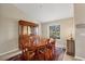 Bright dining room with a formal table and hutch at 193 Tournament Rd, Rotonda West, FL 33947