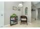 Cozy reading nook with wicker chair, bookshelf, and ambient lighting at 217 Wayne Rd, Rotonda West, FL 33947